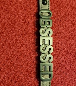 Brown leather band snap bracelet says obsessed